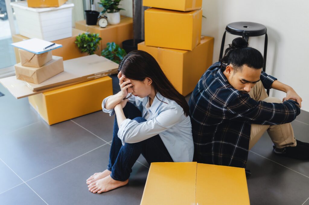 Distressed Asian family couple have debt problem